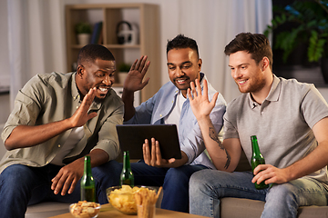 Image showing male friends with tablet pc drinking beer at home