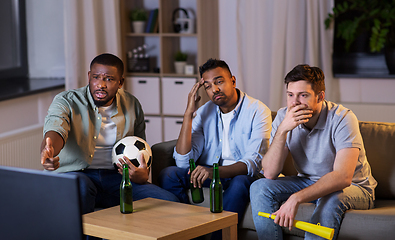 Image showing friends with ball and vuvuzela watching soccer