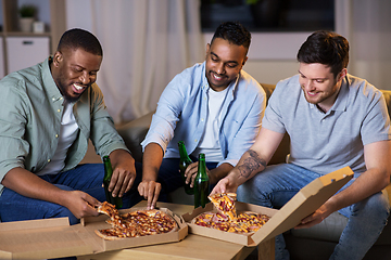 Image showing happy male friends with beer eating pizza at home