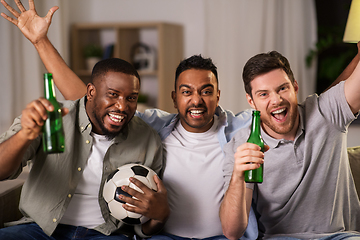 Image showing friends or soccer fans with ball and beer at home