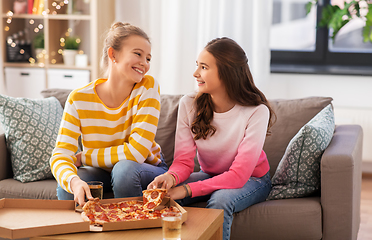 Image showing happy teenage girls eating takeaway pizza at home