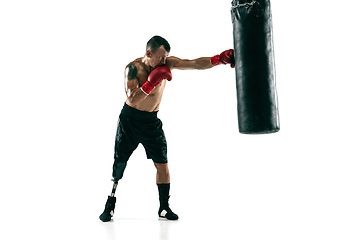 Image showing Full length portrait of muscular sportsman with prosthetic leg, copy space. Male boxer in red gloves.