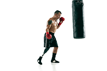 Image showing Full length portrait of muscular sportsman with prosthetic leg, copy space. Male boxer in red gloves.