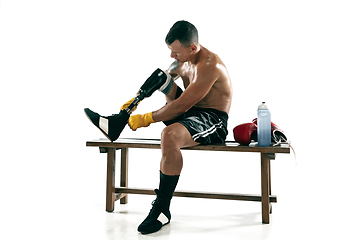 Image showing Full length portrait of muscular sportsman with prosthetic leg, copy space. Male boxer in red gloves.