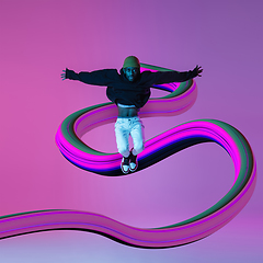 Image showing Stylish man with long fluid flood on gradient background. Negative space to insert your text. Modern design. Contemporary colorful and conceptual bright art collage.