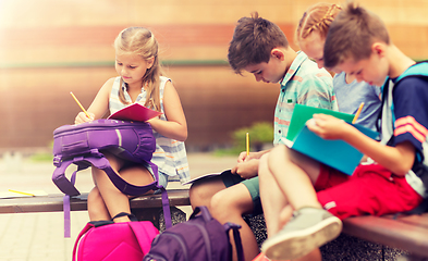 Image showing group of happy elementary school students outdoors