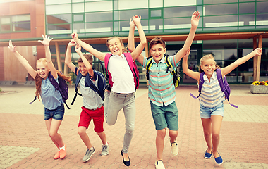 Image showing group of happy elementary school students running