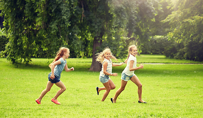 Image showing happy kids running and playing game outdoors