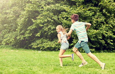 Image showing happy kids running and playing game outdoors