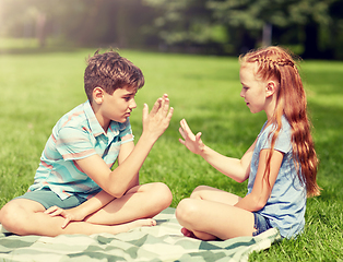 Image showing happy kids playing rock-paper-scissors game