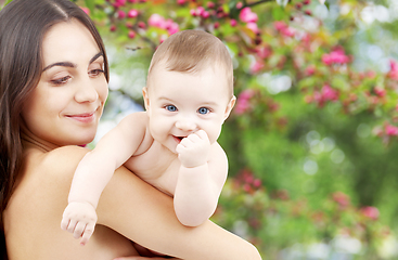 Image showing mother with baby over spring garden background