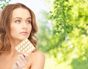 Image showing beautiful woman with medicine pills