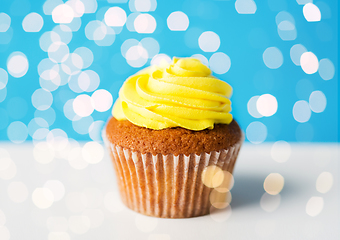 Image showing close up of cupcake or muffin with yellow frosting