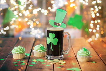 Image showing shamrock on beer glass, green cupcakes and coins