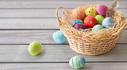 Image showing close up of colored easter eggs in basket