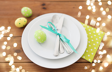 Image showing easter egg in cup holder, plates and cutlery