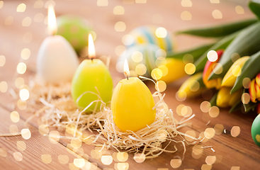 Image showing candles in shape of easter eggs and tulip flowers