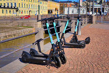 Image showing Tier E-Scooters Parked in City