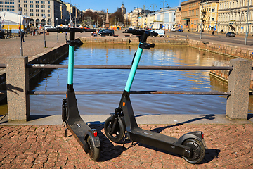Image showing Two Electric Scooters Parked in City