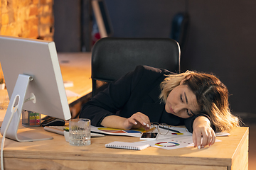 Image showing Businesswoman, manager working in modern office using devices and gadgets