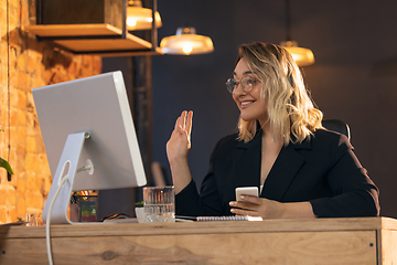 Image showing Businesswoman, manager working in modern office using devices and gadgets