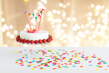 Image showing close up of birthday cake with garland on stand