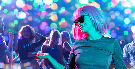 Image showing woman in wig and sunglasses dancing at nightclub