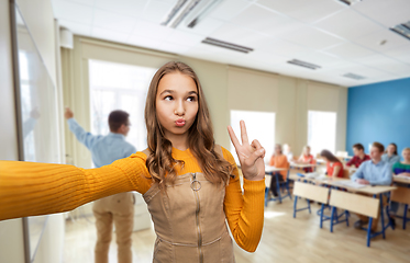 Image showing teenage student girl taking selfie at school