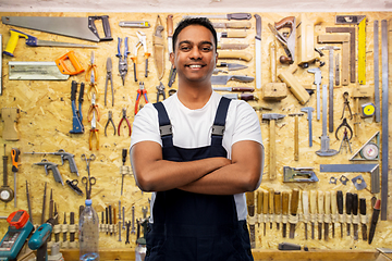 Image showing happy indian worker or builder with crossed arms