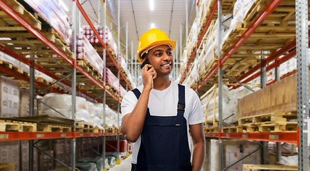 Image showing indian worker calling on smartphone at warehouse