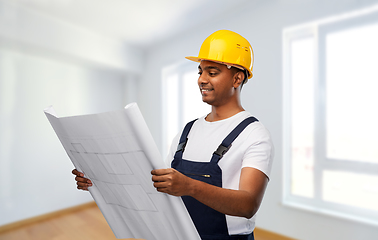 Image showing happy indian builder in helmet with blueprint