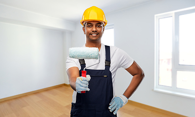 Image showing happy indian painter or builder with paint roller