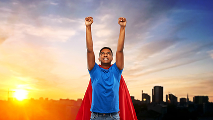 Image showing indian man in superhero cape flying in city