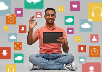 Image showing happy indian man with tablet pc over app icons