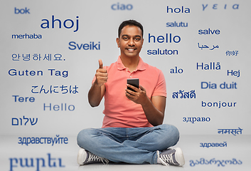 Image showing happy indian man with smartphone showing thumbs up