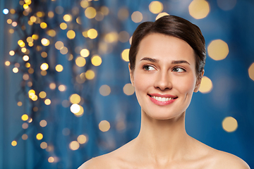 Image showing beautiful smiling young woman with bare shoulder