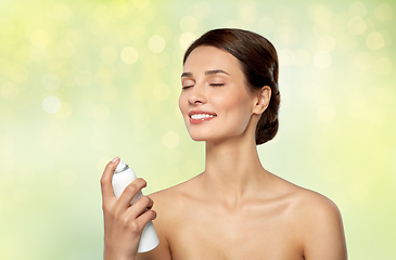 Image showing beautiful young woman with facial spray or mist