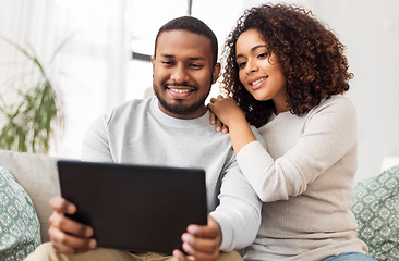 Image showing african american couple with tablet pc at home