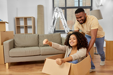 Image showing happy couple moving to new home and having fun