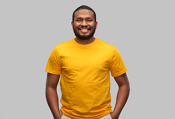 Image showing smiling african american man in yellow t-shirt