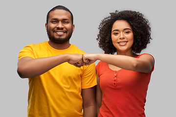 Image showing african american couple making fist bump gesture