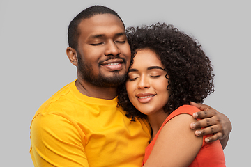 Image showing happy african american couple hugging