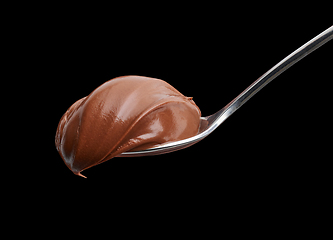 Image showing spoon of melted chocolate cream