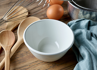 Image showing empty white bowl on wooden table