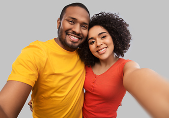 Image showing happy african american couple taking selfie