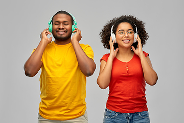 Image showing happy african american couple with headphones