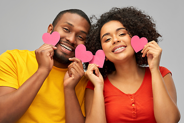 Image showing happy african american couple with hearts