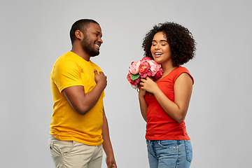 Image showing happy african american couple with flowers