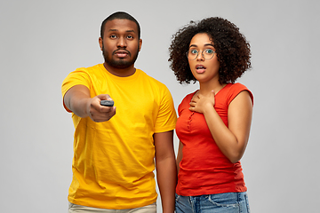 Image showing african american couple with tv remote control