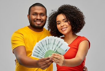 Image showing happy african american couple with euro money